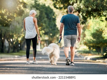 Senior couple, dog walk and nature park road during exercise, walking and leisure during a stroll through the woods. Old man and woman being active for energy and living healthy with a pet outside - Shutterstock ID 2211548891