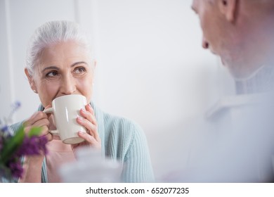 Senior Couple Drinking Tea During Breakfast At Home In The Morning