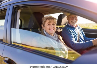 Senior Couple Driving A Car 
