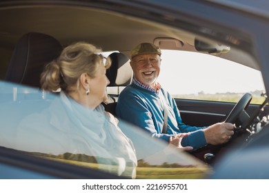 Senior Couple Driving A Car 
