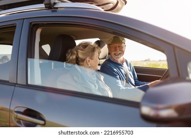 Senior Couple Driving A Car 
