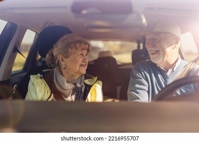 Senior Couple Driving A Car 
