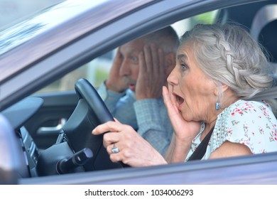 Senior Couple Driving Car