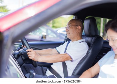 Senior Couple Driving A Car