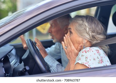 Senior Couple Driving Car