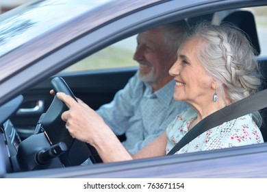 Senior Couple Driving Car