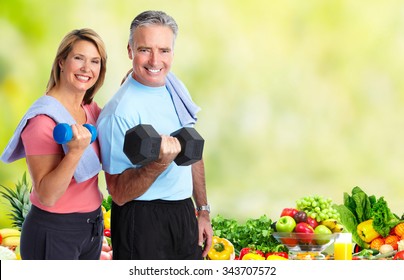 Senior Couple With Dumbbell. Healthy Lifestyle Background.