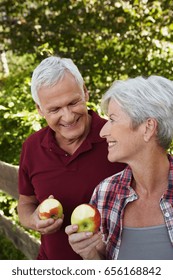 Senior Couple Eating Apples