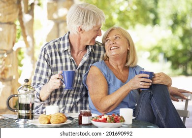 Senior Couple Eating Breakfast Outdoors