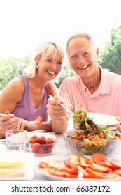 Senior Couple Eating Outdoors