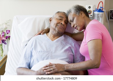 Senior Couple Embracing In Hospital