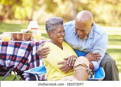 Senior Couple Enjoying Camping Holiday In Countryside - Powered by Shutterstock