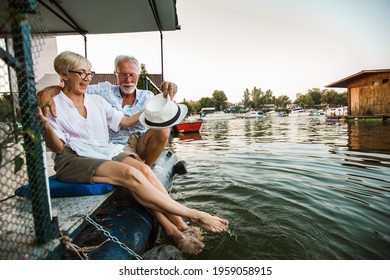 Senior couple enjoying a day in the cottage near the river - Powered by Shutterstock