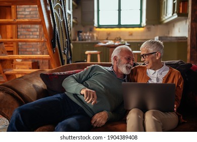 Senior couple enjoying at home with the help of technology - Powered by Shutterstock