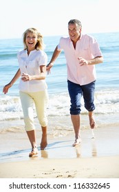 Senior Couple Enjoying Romantic Beach Holiday