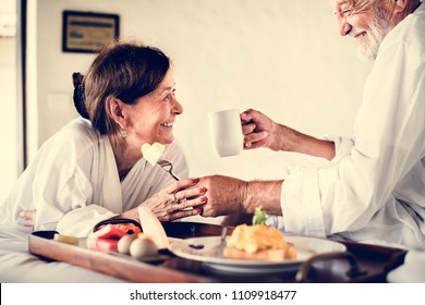 A Senior Couple Enjoying Room Service