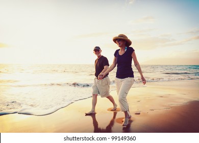 Senior Couple Enjoying Sunset at the Beach - Powered by Shutterstock