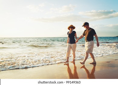 Senior Couple Enjoying Sunset at the Beach - Powered by Shutterstock