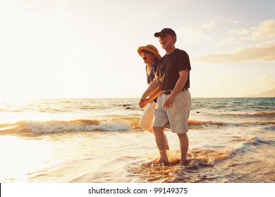 Senior Couple Enjoying Sunset at the Beach - Powered by Shutterstock