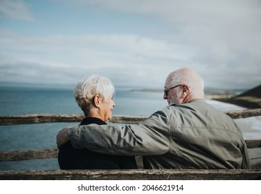 Senior couple enjoying the view of the ocean - Powered by Shutterstock