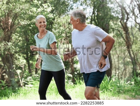 Senior couple, exercise and happy outdoor for run, workout and training for fitness. Old man and woman in forest for cardio health, motivation and wellness in retirement while running in nature
