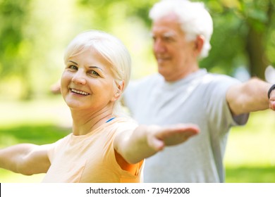 Senior Couple Exercising In Park
 - Shutterstock ID 719492008