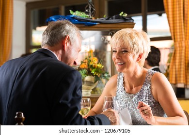 Senior Couple Fine Dining Food At Table In Hotel Or Elegant Restaurant