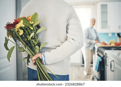 Senior, couple and flowers for love in home, kitchen or husband with bouquet of roses to surprise woman in happy marriage. Man, wife and back hiding gift, flower and romance together on anniversary - Powered by Shutterstock