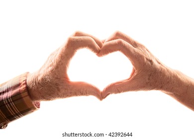 Senior Couple Forming Heart By Touching Hands Together