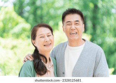 Senior couple with fresh greenery and smiles