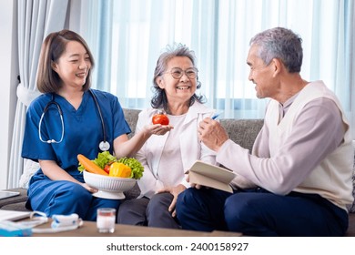 Senior couple get medical advice visit from caregiver nutritionist at home while having suggestion on fresh vegetable meal for healthy eating on probiotic and better digestion system - Powered by Shutterstock