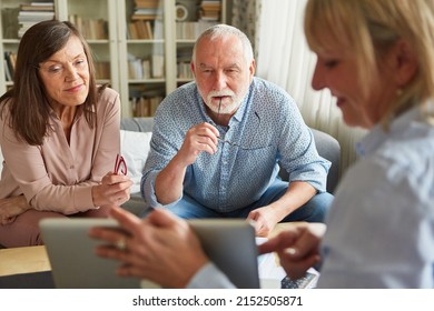 Senior Couple Getting Advice On Financing Care And Retirement From Financial Advisor