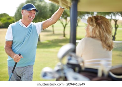 Senior couple in golf cart - Powered by Shutterstock