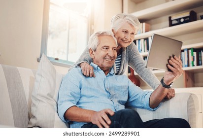 Senior couple, happy and video call on tablet on sofa in house living room for fun conversation. Smile, elderly man and old woman speaking online for communication, talking and virtual chat together - Powered by Shutterstock