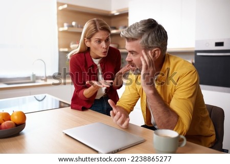 Senior Couple Having Argument. Angry Wife Shouting At Husband Of Problem. Frustrated Husband And Annoyed Wife Quarrelling About Bad Marriage Relationships