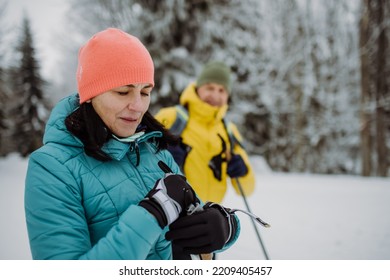 Senior Couple Having Break During Cross Country Skiing.