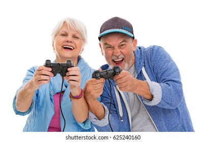 Senior Couple Having Fun Playing Video Games
