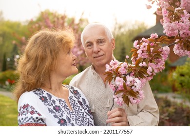 Senior Couple Having Fun In Summer Or Spring Nature Wearing Ukrainian Embroidered Shirt