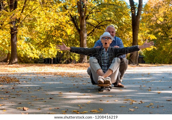 Senior Couple Having Fun Together While Stock Photo (Edit Now) 1208416219