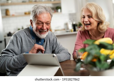 Senior Couple Having Video Call. Happy Husband And Wife Talking With Their Grandkids