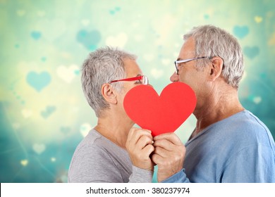 Senior Couple With Heart In Front Of Lovely Background, Mature Couple, Age And People Concept - Happy Senior Couple 