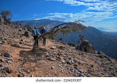 Senior Couple Hiking Along The Grand Canyon In Jabal Shams In Oman