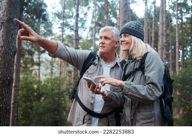 Senior couple, hiking and phone outdoor in nature for direction for exercise, fitness and trekking. Old man and woman with smartphone and hand on forest hike for workout, cardio and gps or compass - Powered by Shutterstock