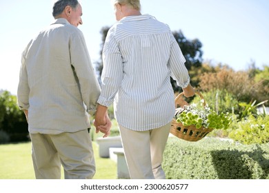 Senior couple holding hands in garden - Powered by Shutterstock