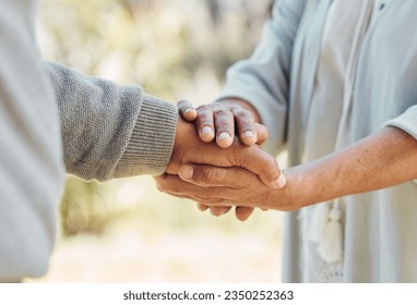 Senior couple, holding hands and love with support in outdoor, nature or bonding in backyard with care, comfort or kindness. Helping, hand and people in retirement together with empathy and trust - Shutterstock ID 2350252363
