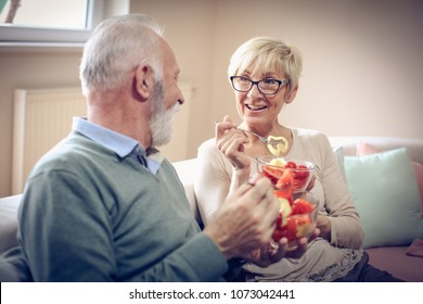 Senior Couple At Home Eating Healthy Meal. 