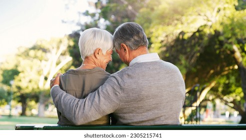 Senior couple, hug and bench outdoor in a park with love, care and support in marriage. A elderly man and happy woman in nature with a smile for quality time, healthy retirement and freedom to relax - Powered by Shutterstock