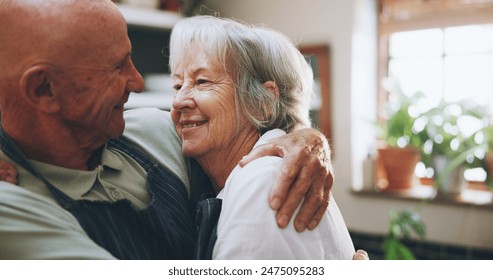 Senior couple, hug and happy in kitchen with love, support and bonding for health, wellness and nutrition. Elderly man and woman embrace for cooking and marriage at home for romance or anniversary - Powered by Shutterstock