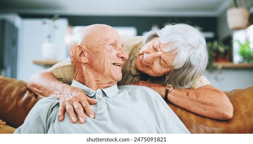 Senior couple, hug and love on sofa with happy marriage, support and conversation of retirement home. Elderly woman talking to man on couch for commitment, health and wellness with trust and security - Powered by Shutterstock