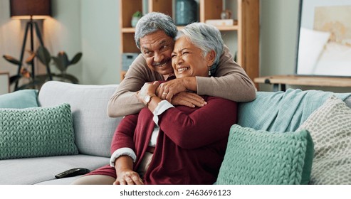 Senior, couple and hug on couch with love for marriage, commitment and safety with security on weekend break. Man, woman and together on sofa for bonding with comfort, close and trust with romance. - Powered by Shutterstock